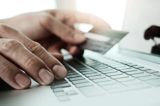 close up of hands using laptop and holding credit card  as Online shopping concept                    .jpeg