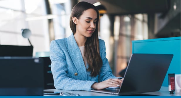 Businesswoman works with integration and business automation solutions on her laptop in a modern office