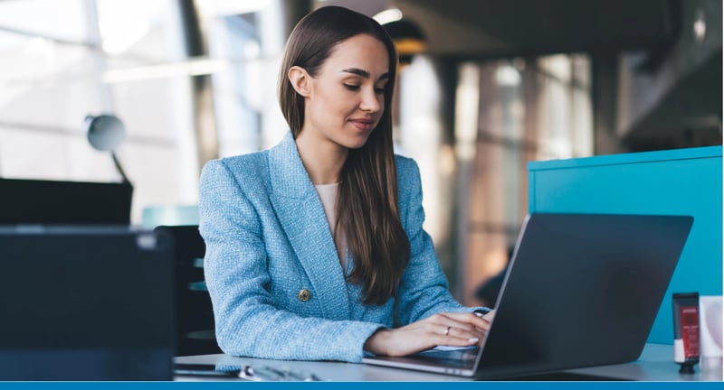 Businesswoman works with integration and business automation solutions on her laptop in a modern office
